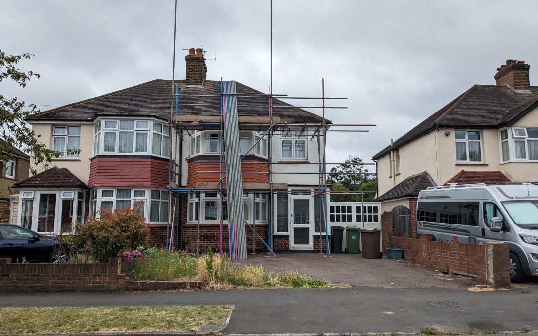 Construction begins for a loft conversion to a semi-detached house in Ewell